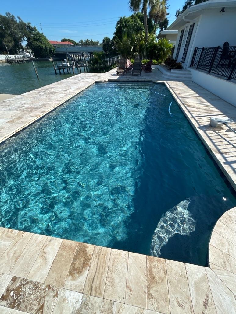 Sparkling clean backyard pool serviced by The Orlando Pool Masters