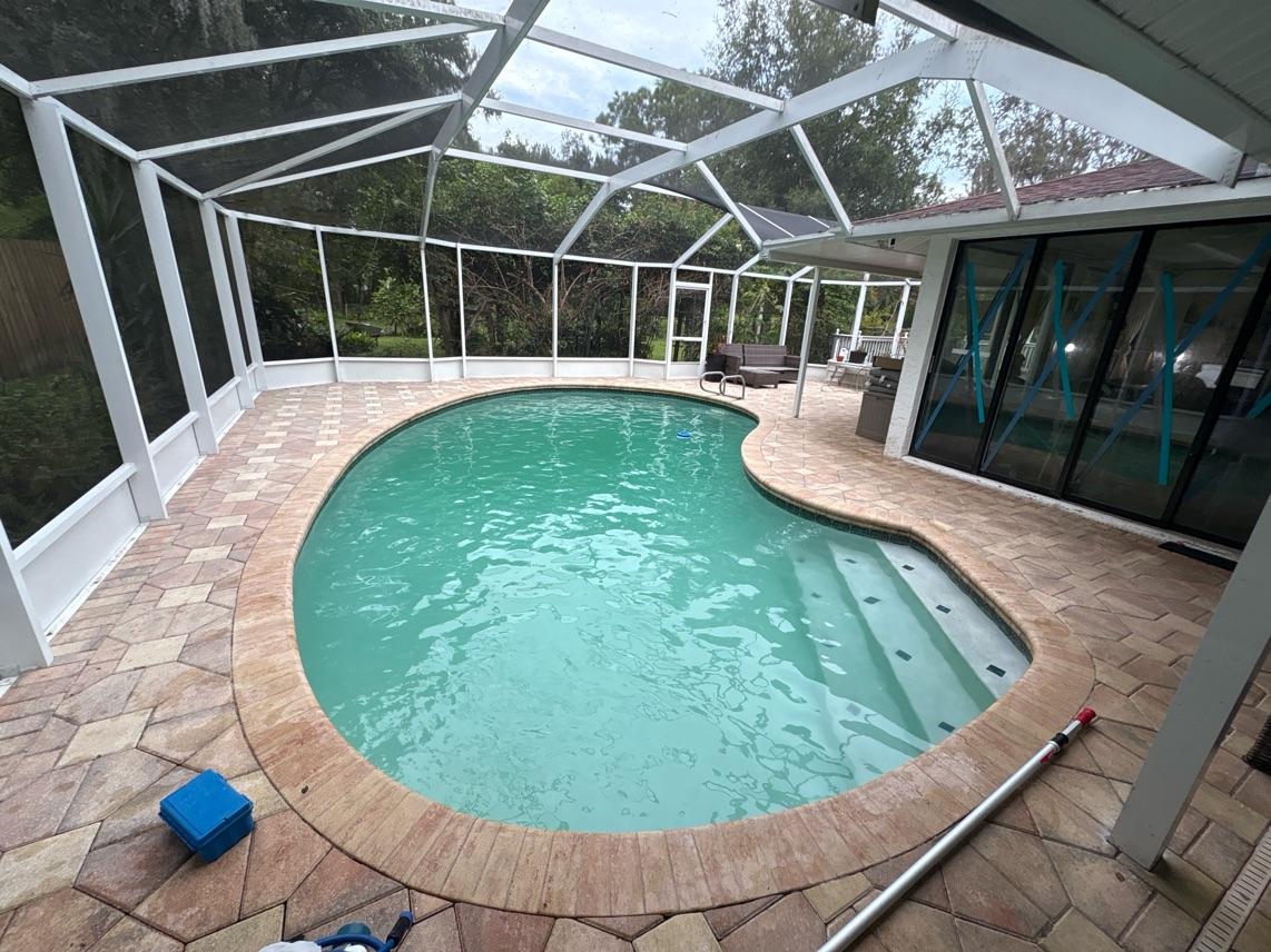 Orlando Pool Masters technician testing pool water chemistry